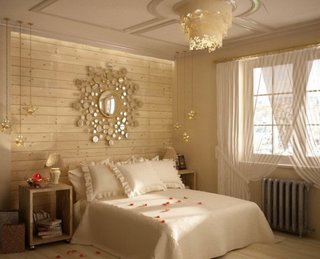 Dormitor cu pat alb si peretii placati cu lambriu din lemn pentru un stil rustic