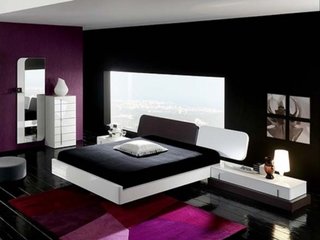 Dormitor amenajat in stil contemporan cu peretii negri si mobila alba