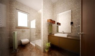 Oglinda simpla de baie fara rama aplicata pe perete placat cu mozaic crem